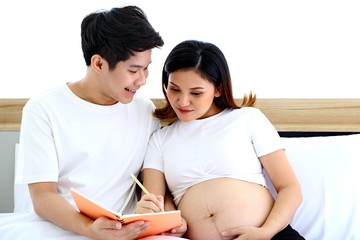 Young man taking care of young wife while pregnant