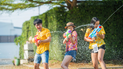 Fototapeta premium Asian people are using water guns play songkran festival in the summer april