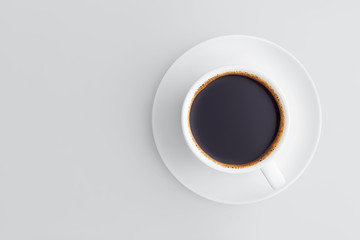 Flat lay coffee cup on a saucer filled with black coffee with froth on a gray background with copy space.