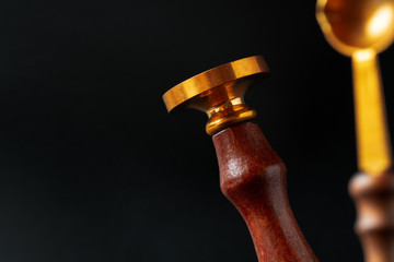 Wax seal stamp on dark black background