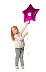Cute little blonde girl with purple star shaped baloon isolated on white background