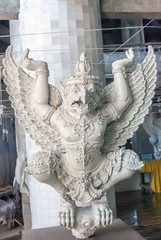 Traditional white Garuda wooden statue in Thailand