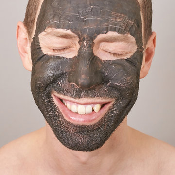 Man Portait With Face Mask Crack. Smiling Emotion. Mature Caucasian Beautiful Male Portrait. Happy Model Close Eyes At Studio