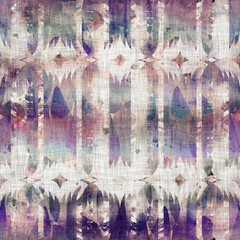 Seamless mixed media collage design in old aged worn look. Tribal kilim rug design overlaid, mottled, and distressed on fabric texture. Seamless repeat raster jpg pattern swatch.