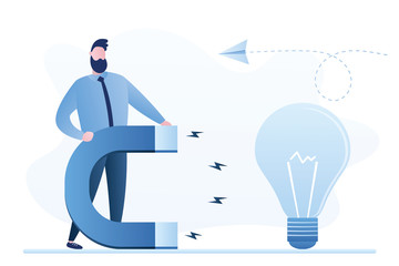 Handsome businessman holding with a huge magnet attracting idea bulb. Brainstorming and new ideas concept.