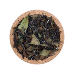 Loose tea Isolated on a white background. On coasters made of cork. Assortment concept for a tea shop, teahouse. Tea collection.