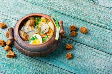 Meat soup in a clay pot