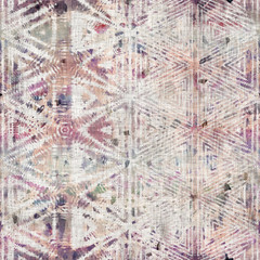 Seamless mixed media collage design in old aged worn look. Kaleidoscopic geo design overlaid, mottled, and distressed on fabric texture. Seamless repeat raster jpg pattern swatch.