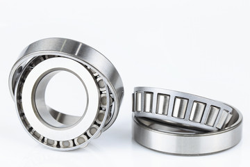 Close-up Tapered Roller Bearings spare part of mechanical on the white background..