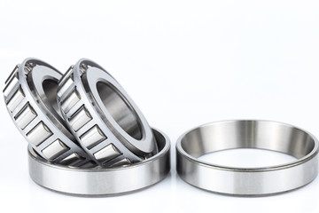 Naklejka premium Close-up bearings spare part of mechanical on the white background..