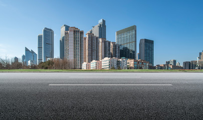 Qingdao urban skyline and asphalt road architectural landscape..
