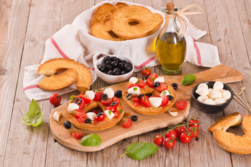 Friselle with tomatoes and mozzarella cheese.