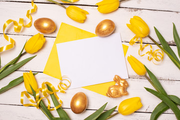 Happy Easter. Congratulatory easter background. Easter eggs and flowers.