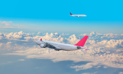 Two comerical passenger airplanes in the sky with busy air traffic - Airplane taking off from the...