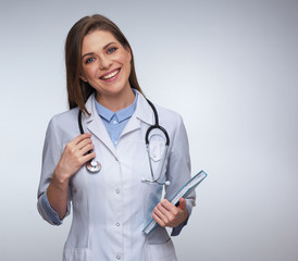 Young woman doctor with big toothy smile holding book