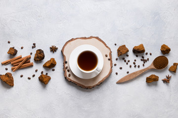 Chaga infusion beverage in cup. Trendy Russian healthy infusion.