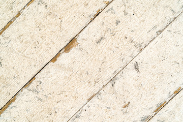 Fototapeta premium Wooden floor texture background. Diagonal worn boards. Vintage floor