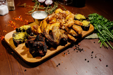 Selection of beer and snacks.Chips, fish, beer sausages on the table