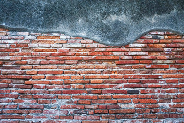 Crack red brick wall texture surface background with black cement concrete,Empty old brick design