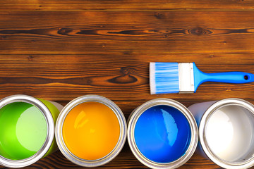 House renovation, paint cans on the old wooden background with copy space - Image