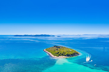 Croatian Adriatic coast, beautiful blue seascape, small island near Pakostane, drone aerial view
