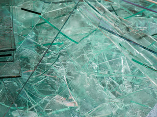 Sharp sheet glass waste waiting the transport back to the factory for recycle.