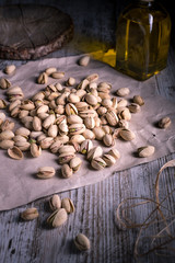 still life of isolated pistachios in the foreground in studio.