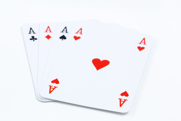 Four playing cards of aces isolated on white background