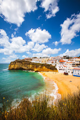 View of Carvoeiro on the Algarve in Portugal...A perfect sky over a sunny each and colourful seaside town
