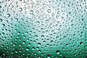 Water drops on window glass. Rain texture or wet pattern background.
