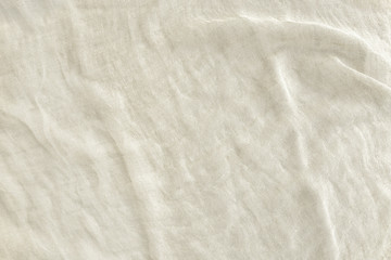 Naklejka na ściany i meble Pure washed linen cloth background. Natural washed linen fabric..