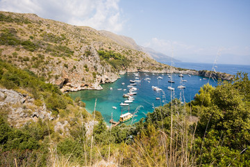 Infreschi Bay, Vessels moored in the bay Baia degli Infreschi on the Masseta coast of Cilento in...