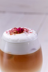 latte with rose on the wooden background