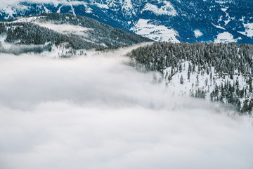 Obraz premium Drone aerial view of snowy mountains in Kronplatz