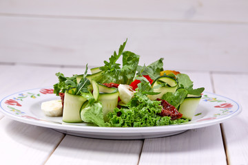 zucchini rolls with fresh salad
