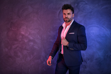 Portrait of handsome man in elegant suit.