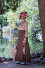 Elegant lady, from high society of the twentieth century, walking through a public park