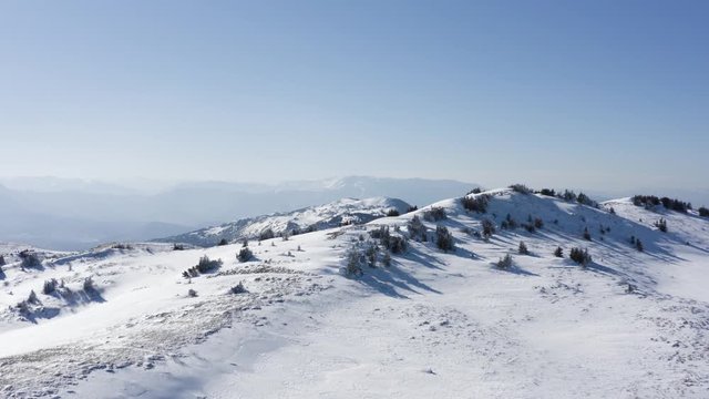 Cinematic drone fly over mountain to discover beautiful areal view of untouched snow covered mountains. Beautiful nature with mountain peak. Filmed in 4k