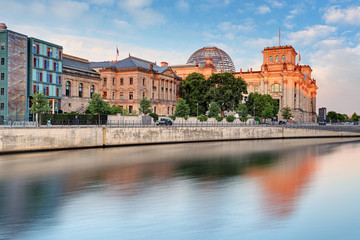 Fototapeta na wymiar Reichstag with reflection in Spree, Berlin