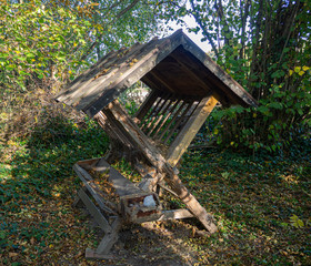 Naklejka premium Feed manger for wild animals in a small clearing in the forest