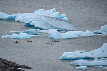 Kayaking between icebergs in front Grey Glacier in the Southern Patagonian Ice Field, Chile
