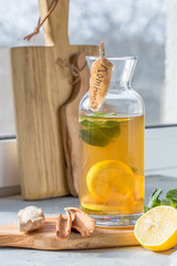 Fototapeta premium Kombucha or cider fermented drink in bottle. Heathy probiotic drink