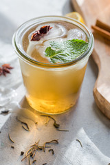 Cold Lemon green tea in glass with anise ice. Heathy summer probiotic drink