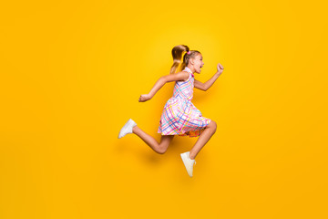 Full body profile side photo of cheerful crazy little girl jump run fast spring time bargains wear trendy style stylish skirt gumshoes isolated bright shine color background