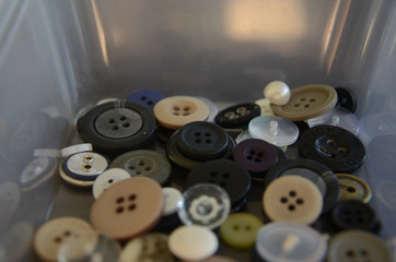 Collection of random buttons inside a container