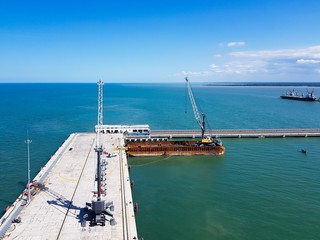 2 units of Harbor Mobile Crane (HMC) are being loaded onto barges