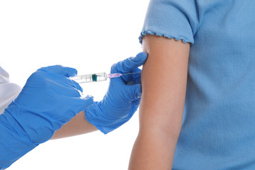 Little girl receiving chickenpox vaccination on white background, closeup. Varicella virus...