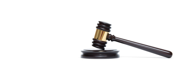 A wooden judge gavel and soundboard isolated on white background