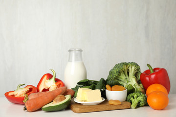Different natural food rich in vitamin A on white table