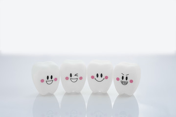 Four teeth smile emotion on white background with copy space